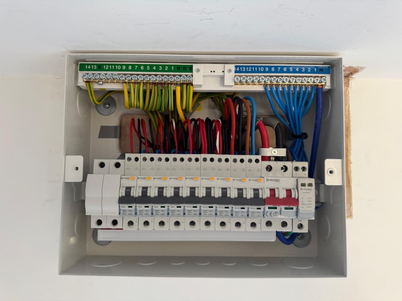 New consumer unit neatly wired with individual RCBOs and surge protection during a fuse box upgrade