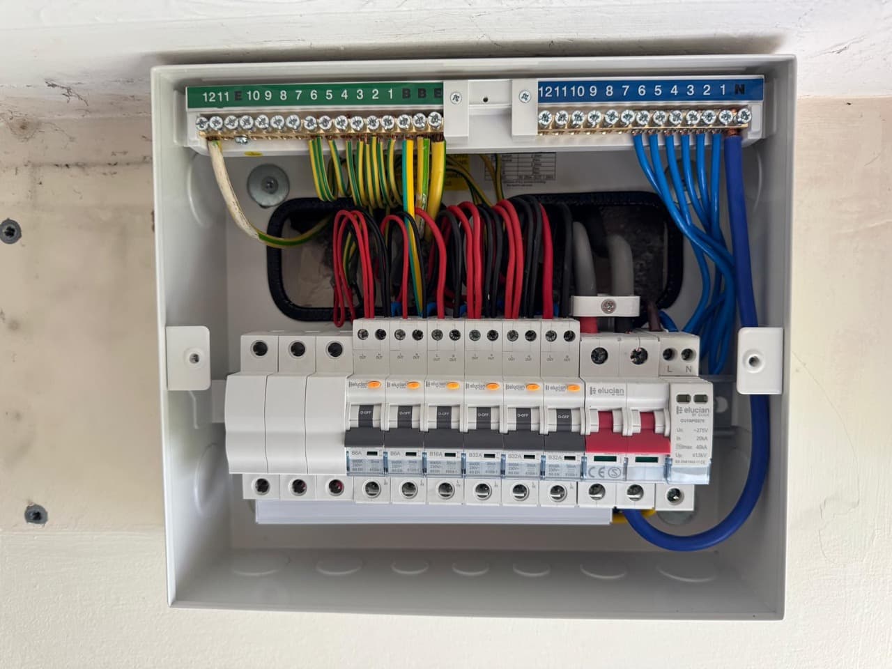 Consumer unit with surge protection and colour-coded circuits ready for testing